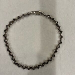 Dazzling Sterling Silver Bracelet with Intricate Detailing. Stamped 925.